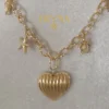 COLLAR ERYNA CORAZÓN Y CHAKRAS MARINOS ACERO DORADO
