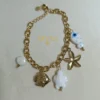 PULSERA ERYNA CHARMS MARINOS DORADO & COLOR