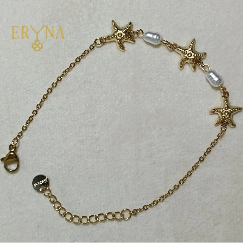 PULSERA DE ACERO DORADO CON ESTRELLAS DE MAR Y PERLAS