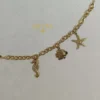PULSERA ERYNA CHARMS MARINOS ACERO DORADO