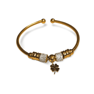 Pulsera rígida dorada de acero inoxidable con circonitas y trébol