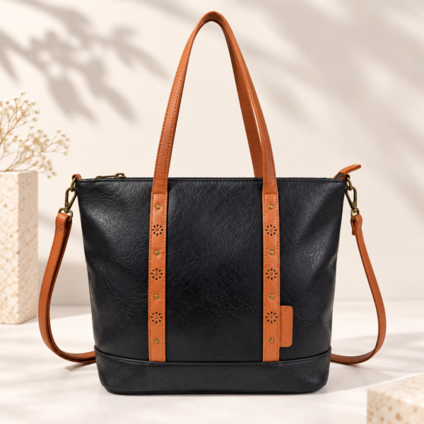 Bolso tote en color negro con asas dobles troqueladas y bandolera desmontable con mosquetones