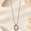 Collar Colgante Ovalado de Acero Inoxidable Plateado - ERYNA Collar colgante ovalado de acero inoxidable plateado con cadena fina tipo serpiente